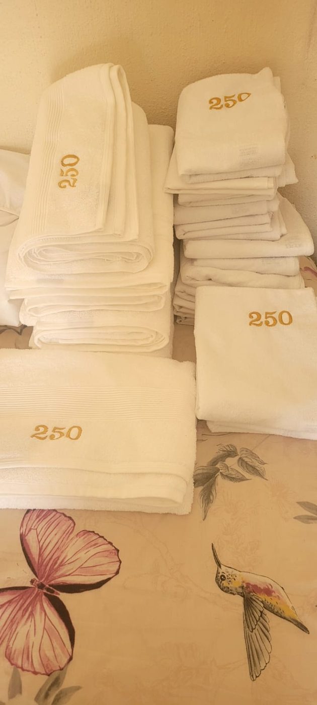 Bulk numbered towel order embroidered by JJ Embroidery Services